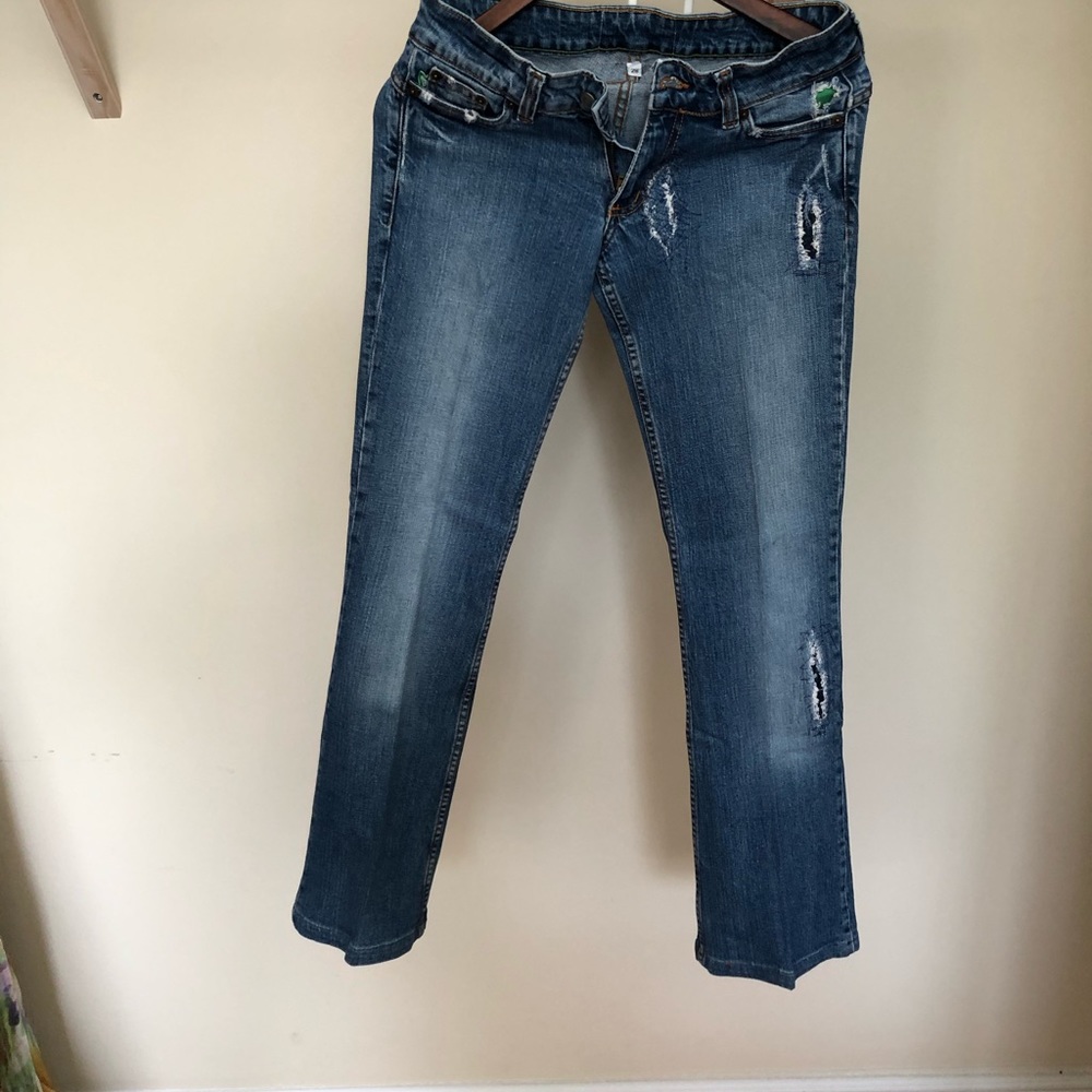 Distressed green jeans